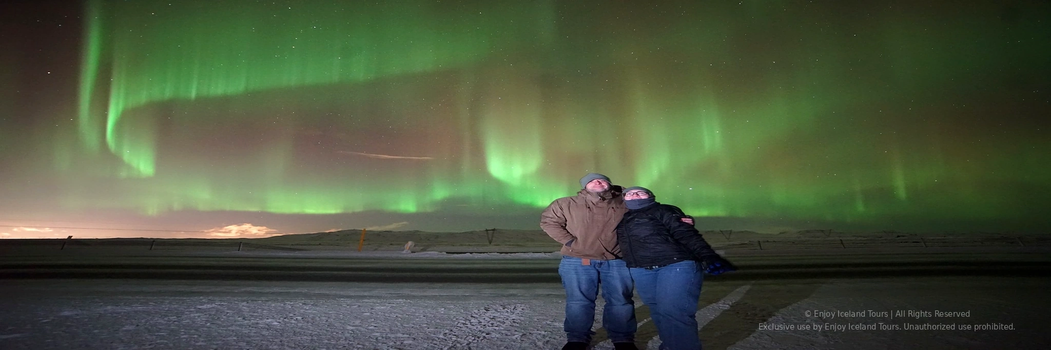 Small group enjoying a private Northern Lights tour in Iceland